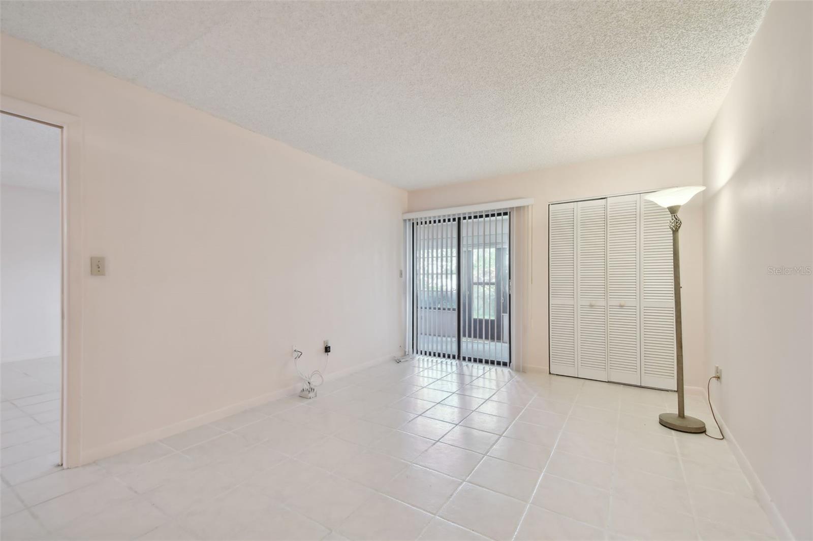 Master bedroom with separate door to back patio and two separate closets