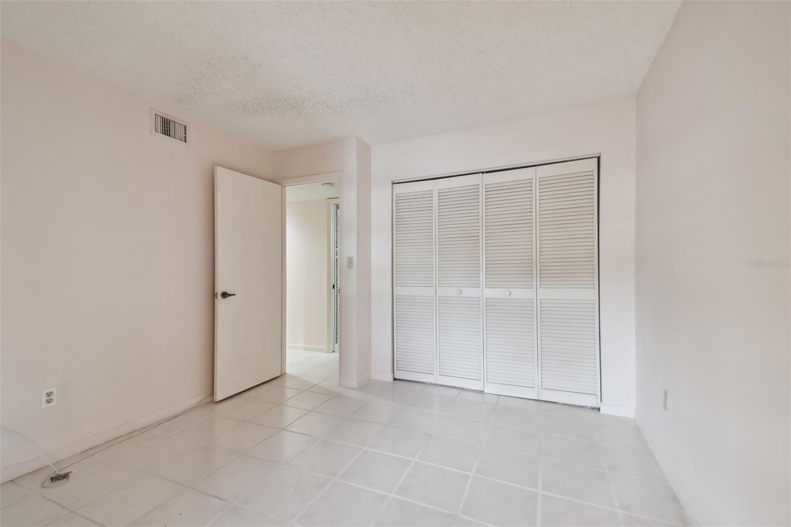 2nd bedroom with adjacent bath