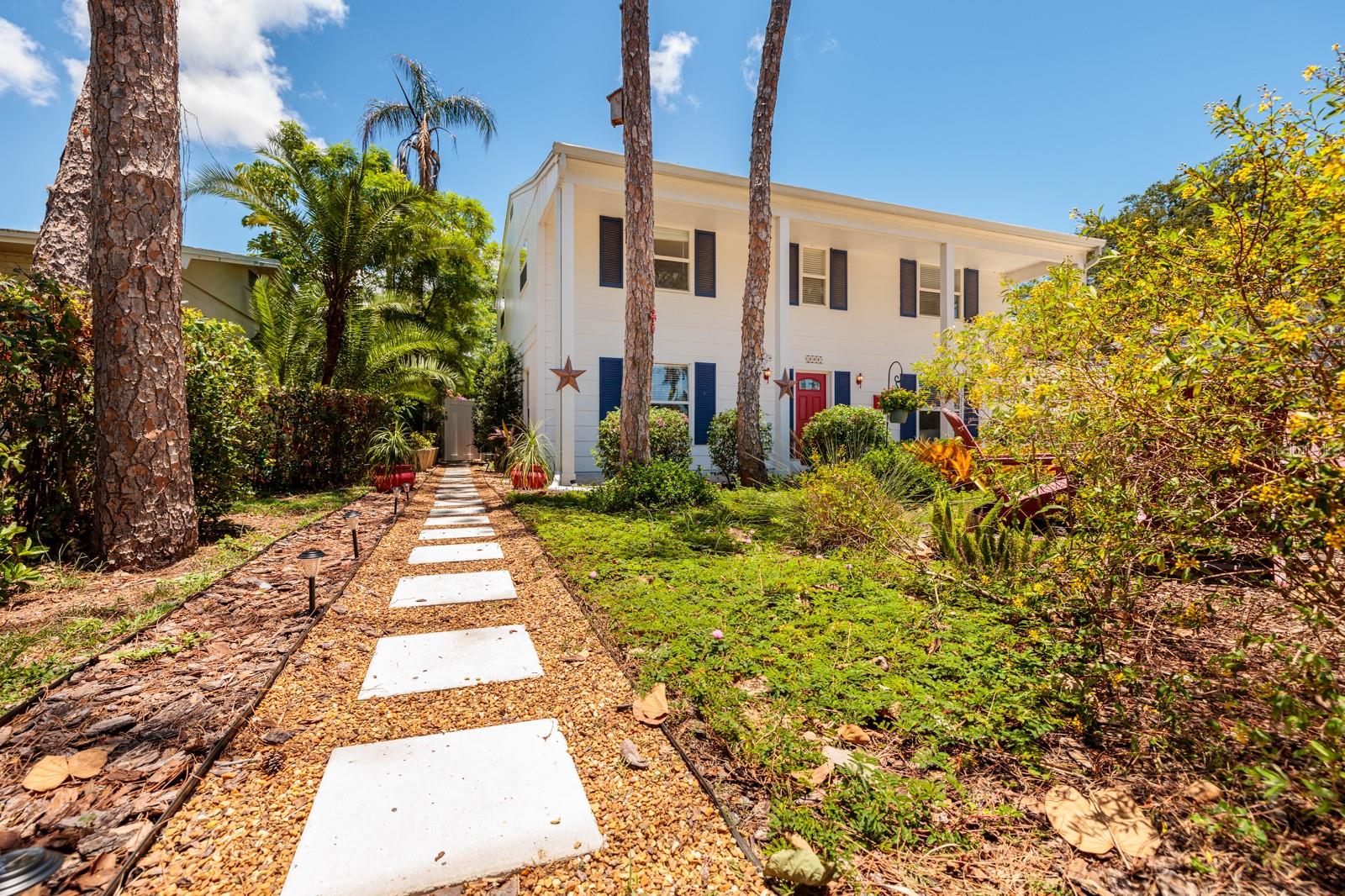 Side path allows guests to walk to the backyard pool without entering the house