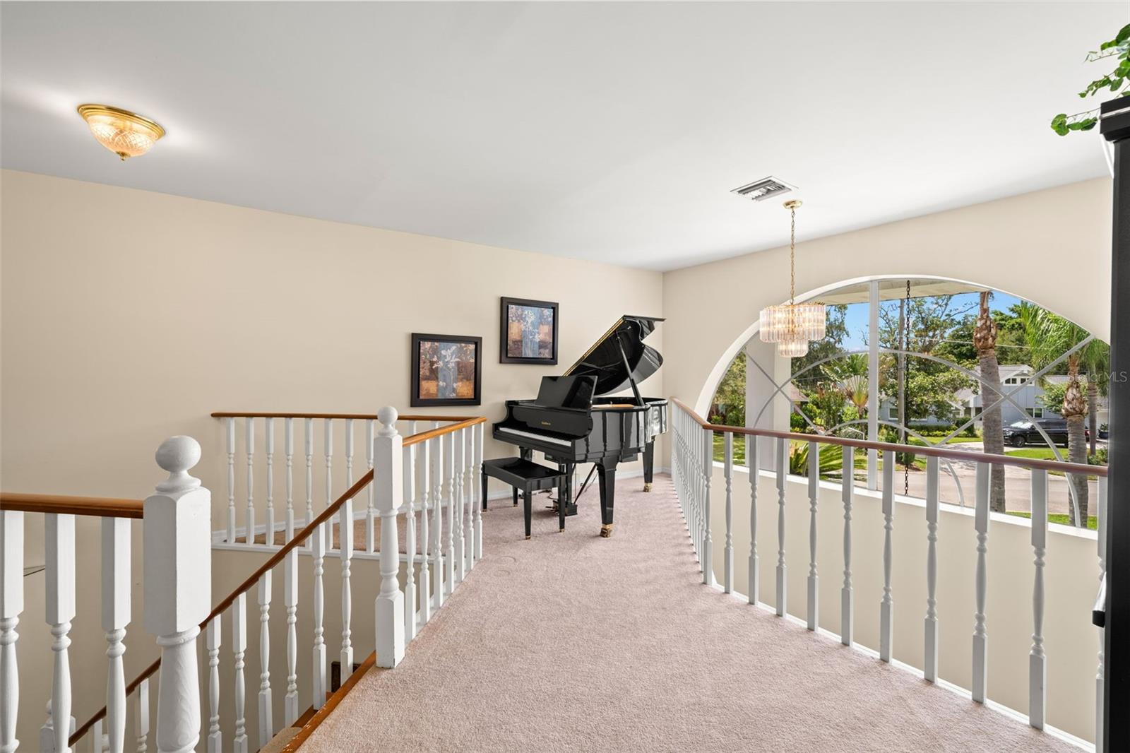 The loft looks over the front entry and adjoins the upstairs living space.