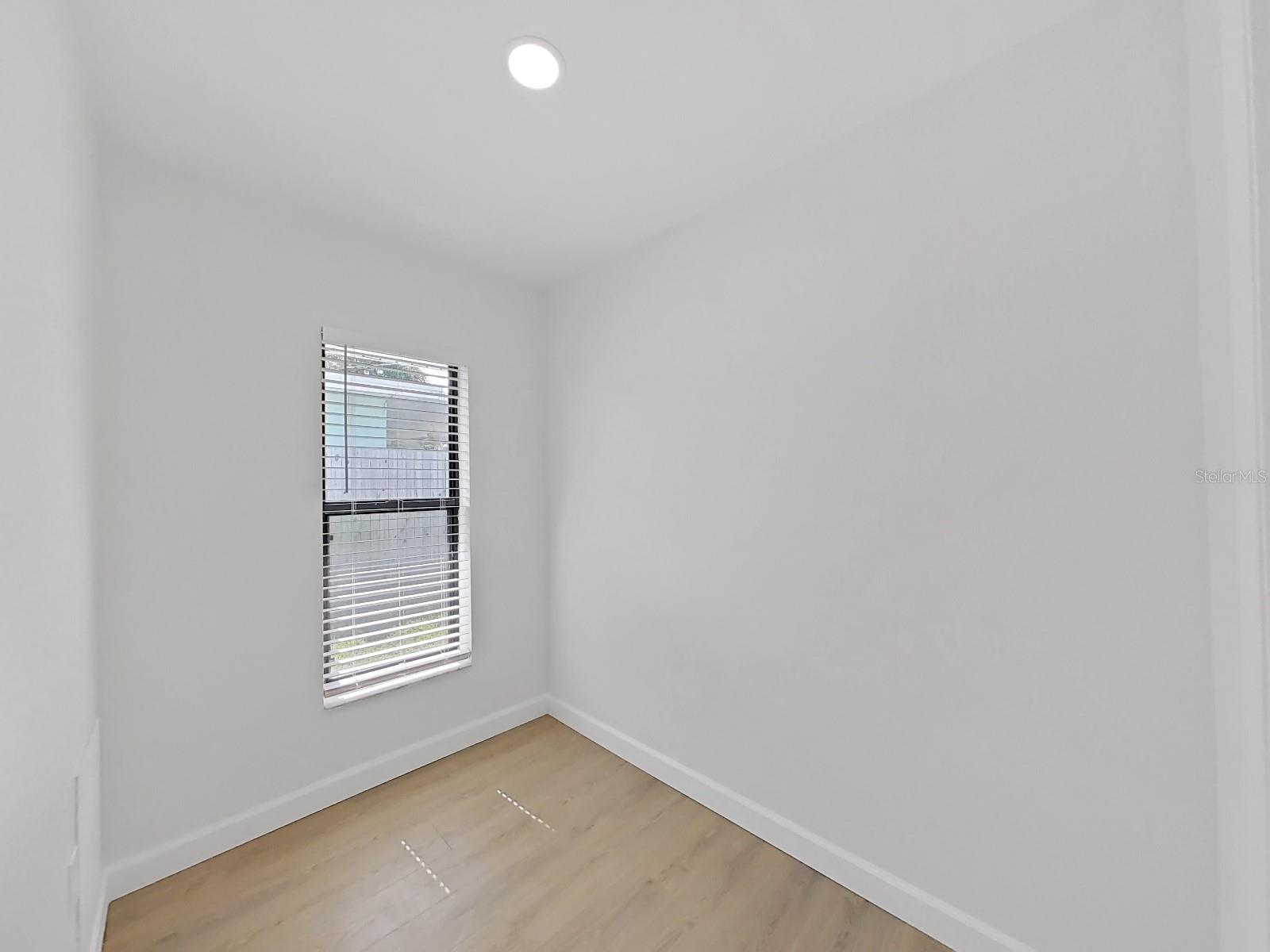 Walk-in closet with the window in primary bedroom