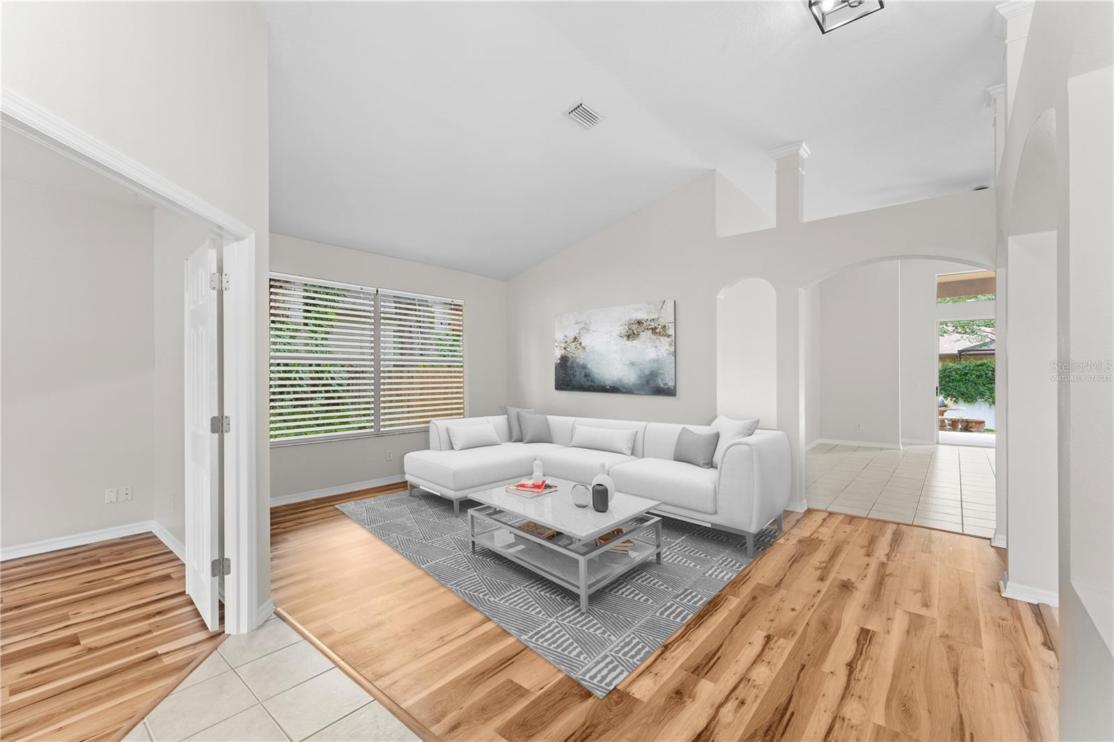 Virtually Staged Foyer facing Living Room