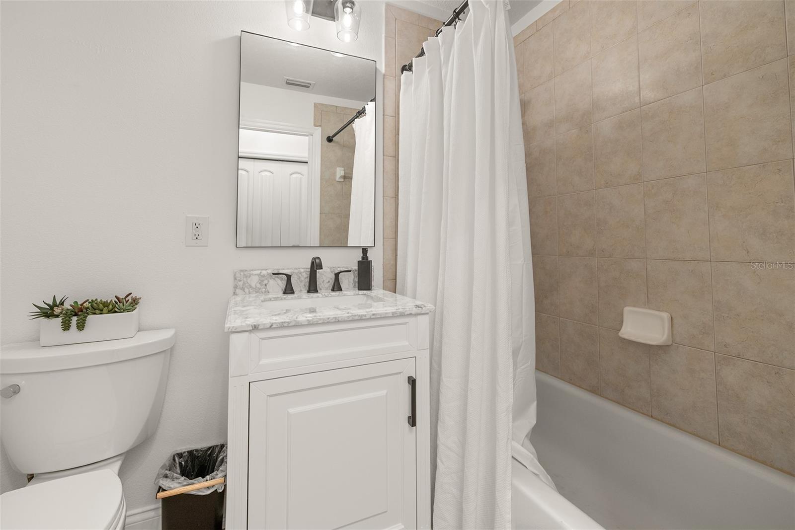 1st floor guest bathroom with tub