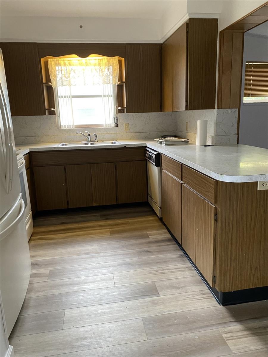 Kitchen after new flooring installed.