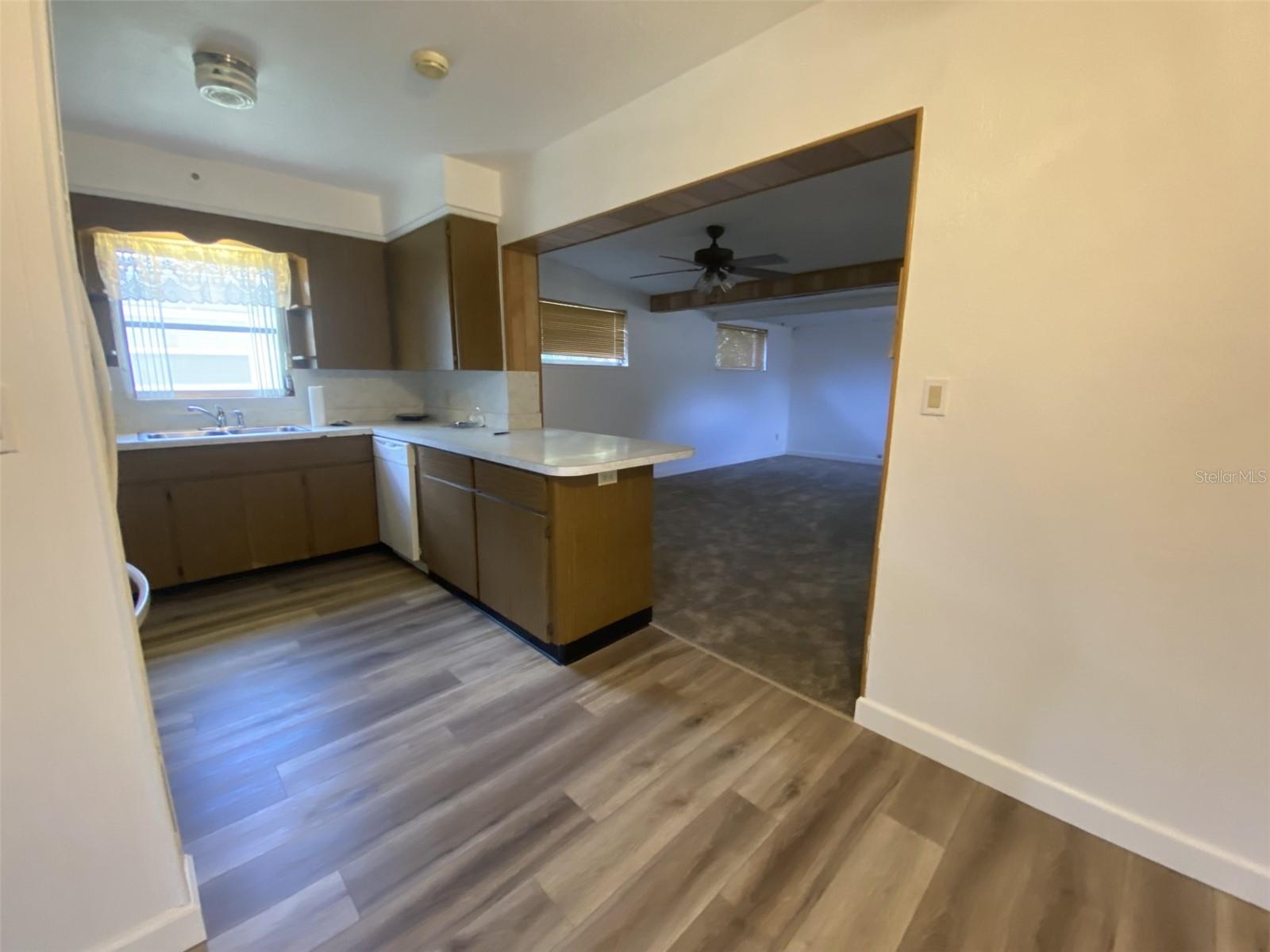 Kitchen and Florida room with new carpet