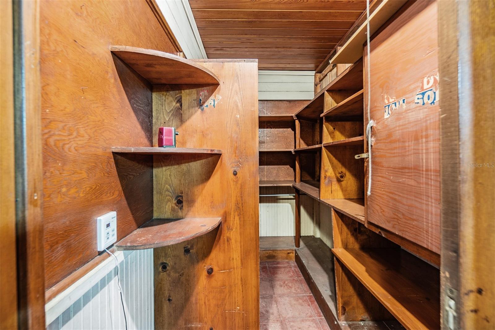 Walk in closet in the Bar room. Could be converted to master bath