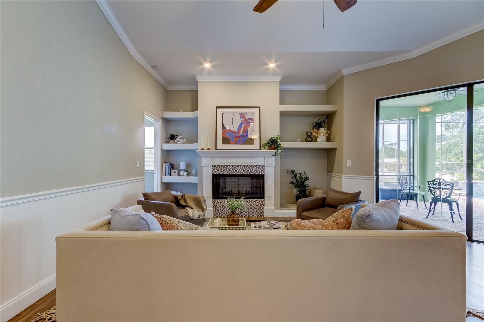 Living room with view of the pool. Door on the left leads to Bedroom 2.