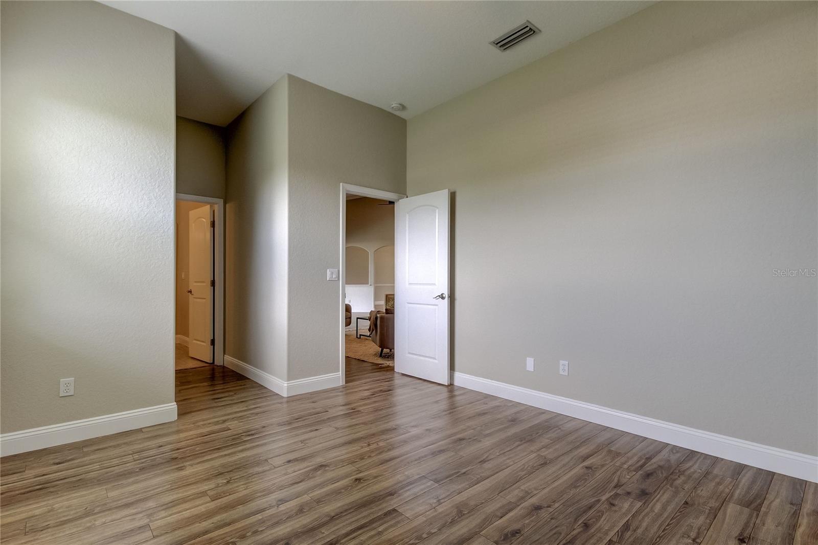 Bedroom 2, doorway to en-suite/pool bath