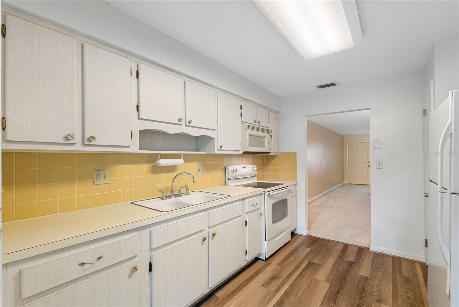 Kitchen looking into Living room/Dining room