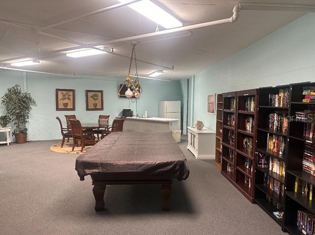 The social room is a great place to meet with extra guests! It includes a pool table, a card table, a nice kitchenette and shelves of great reading!