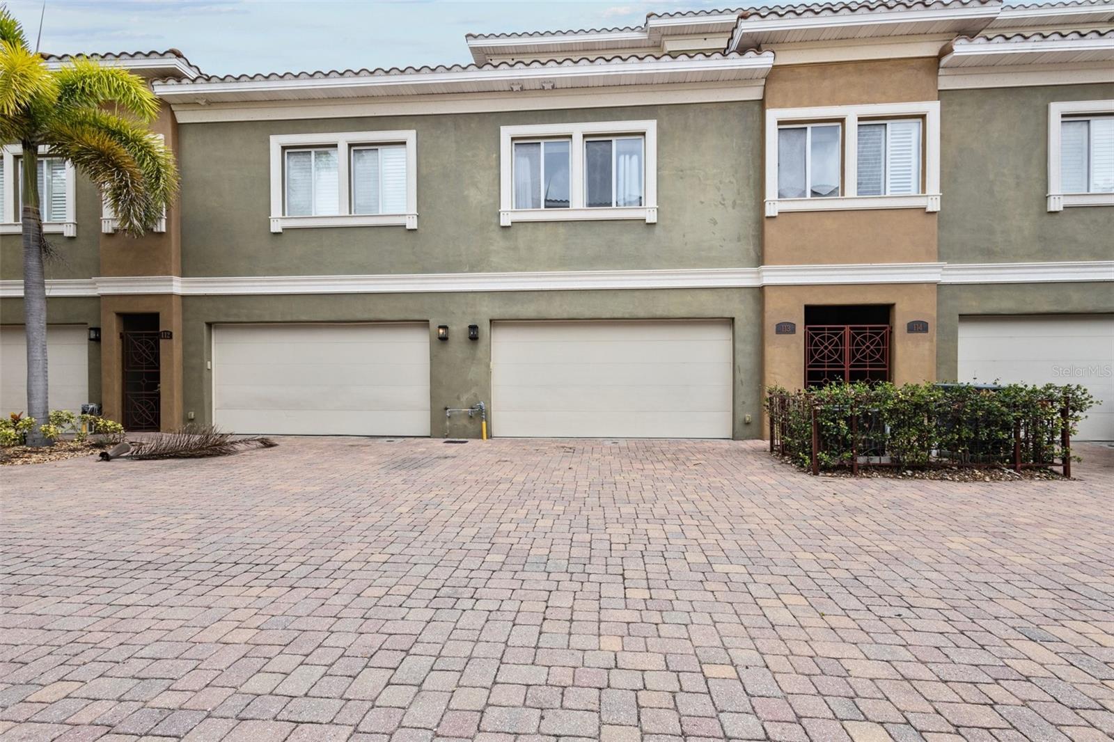 Pavered driveway to 2-car garage