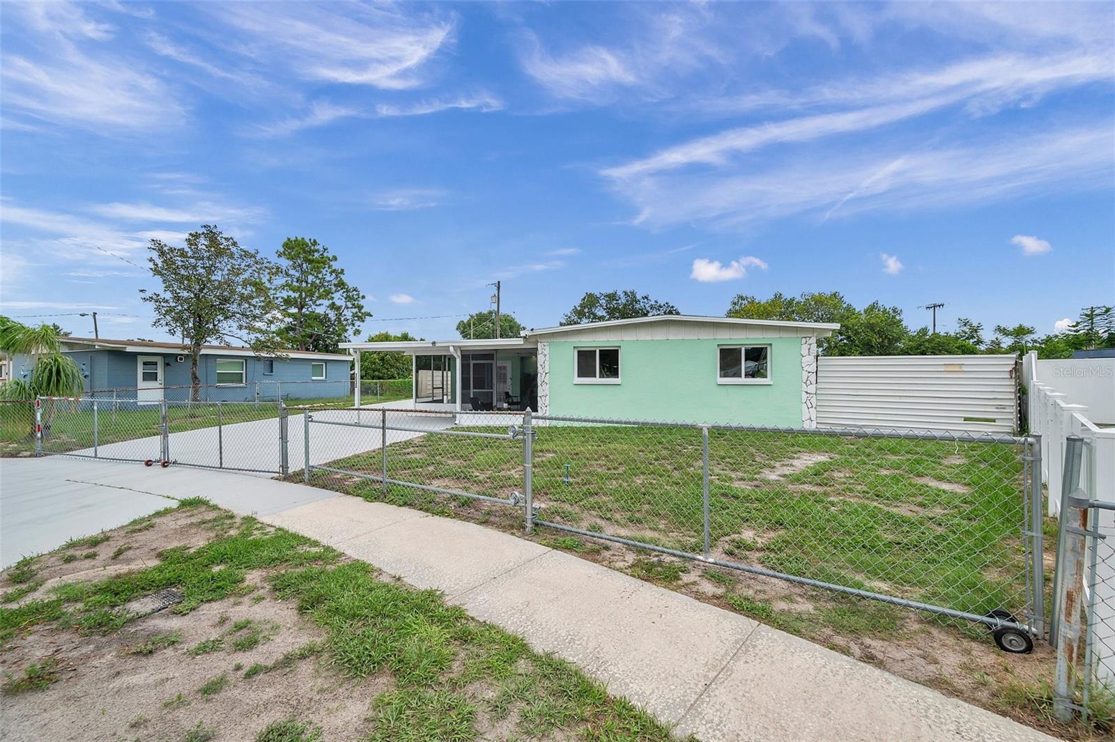 Right side gate opens to allow for parking in the garage/ backyard