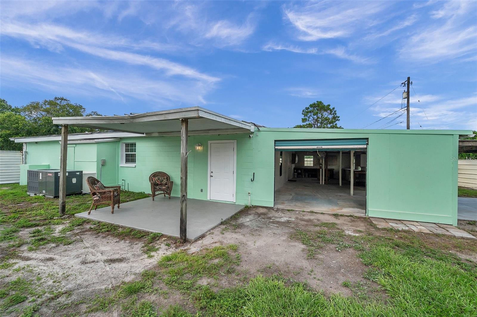 Garage parking entrance and covered patio from the kitchen/ butlers pantry.