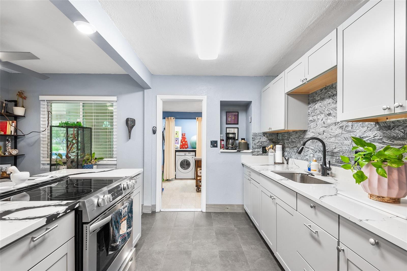 Kitchen leads into Pantry / Laundry