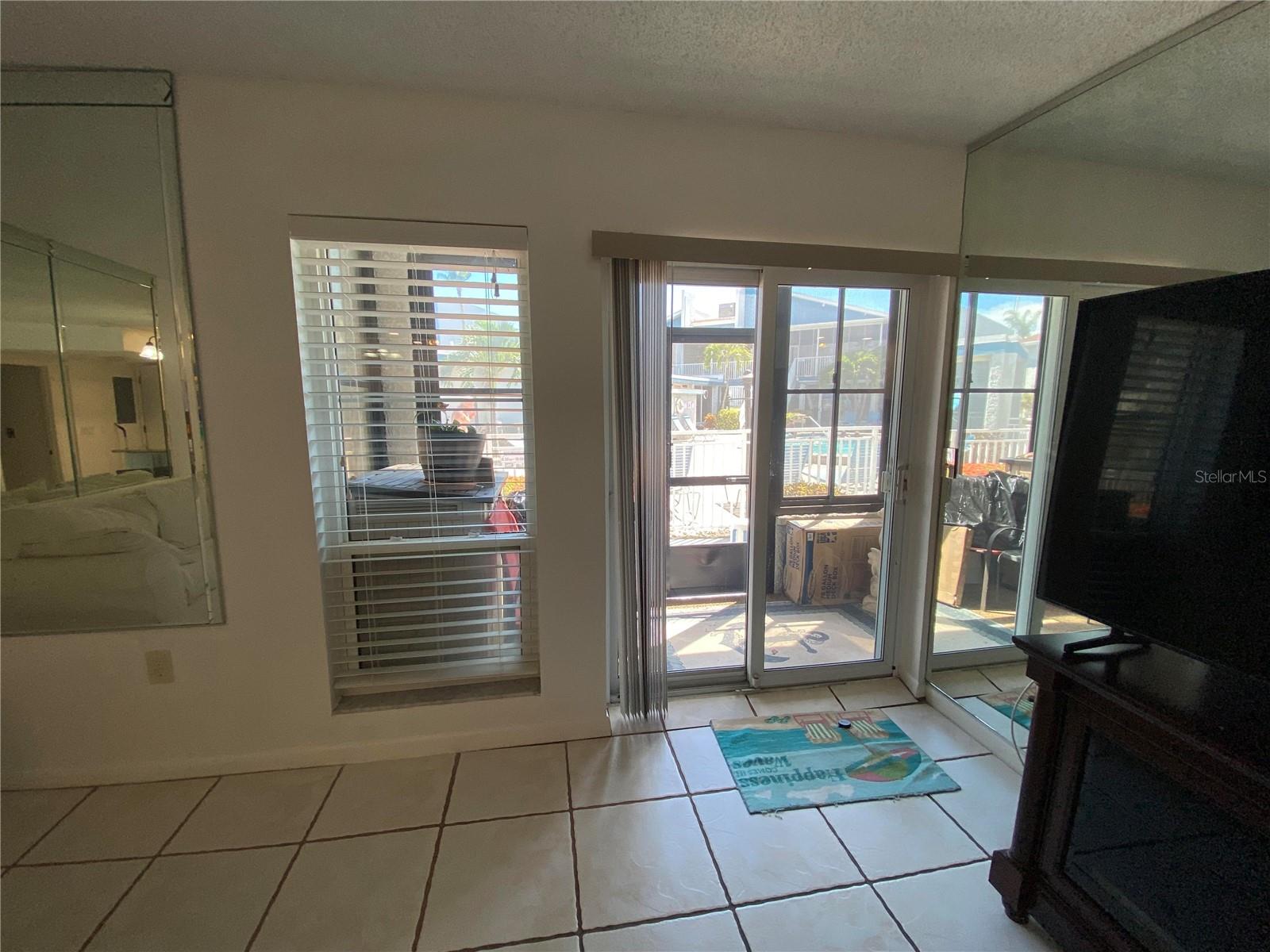 View of the heavy sliding doors that keeps ALL NOISE OUT from the pool area