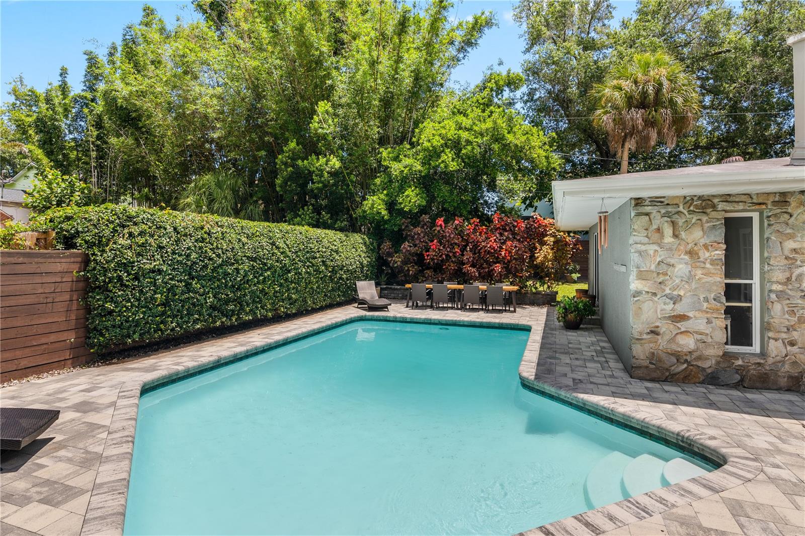 The pool area complete with Jasmine wall.