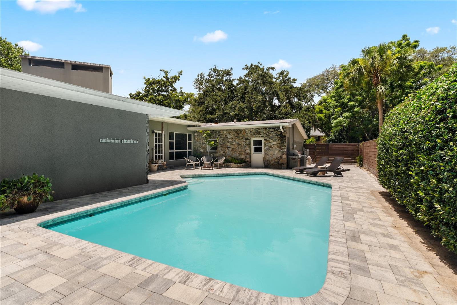 Additional paved area next to the garage. Room for a boat or more entertaining. Garage door leads to bathroom