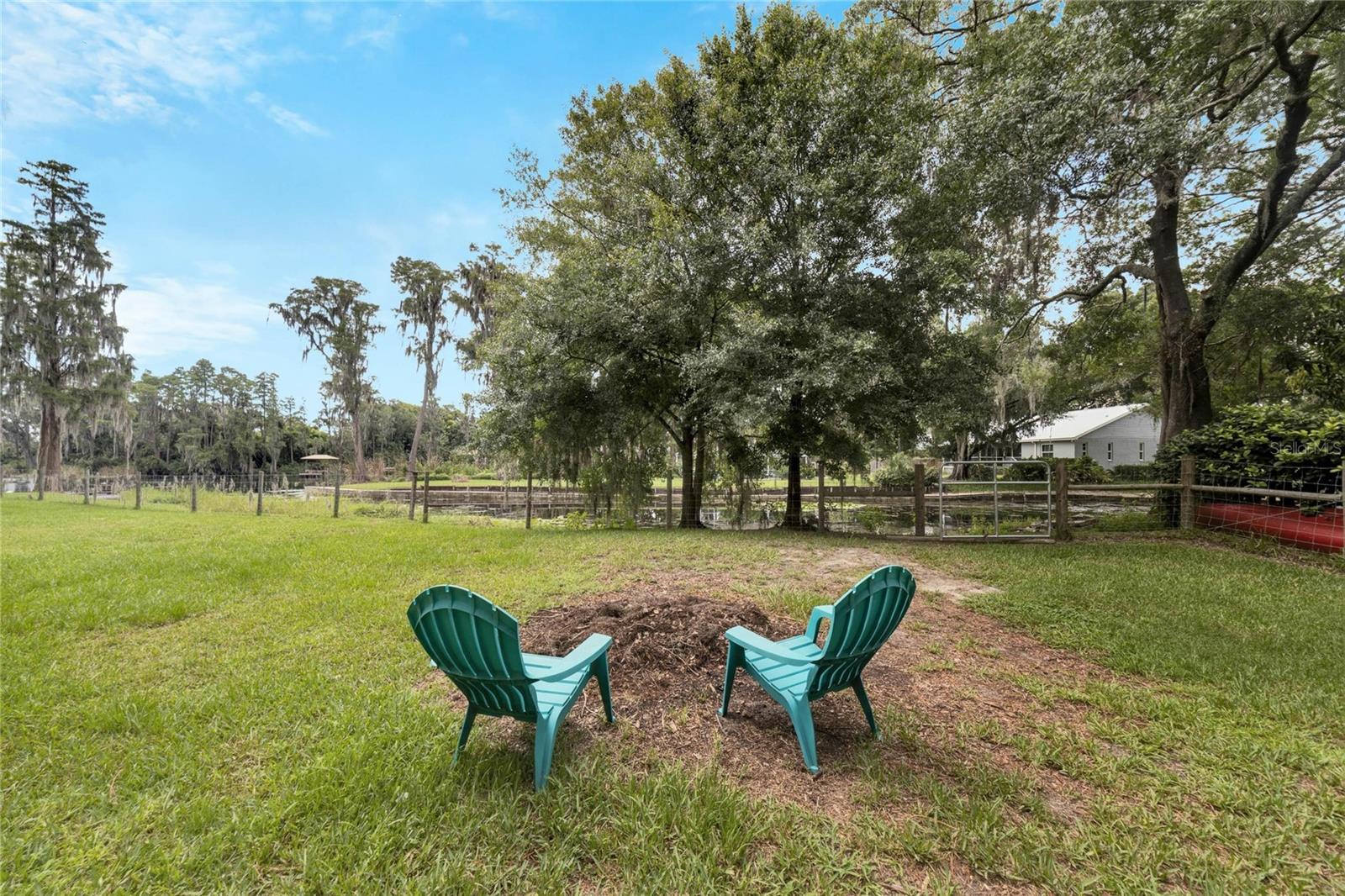 A fire pit over looks the lake