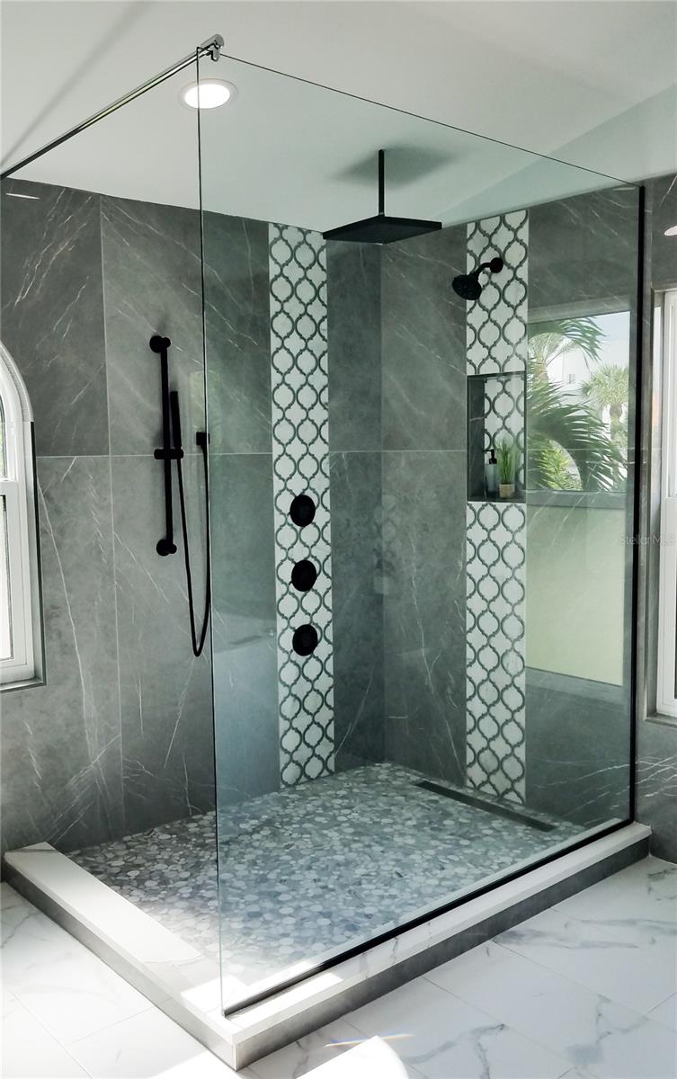 Primary bath shower with rain shower and multiple shower water features