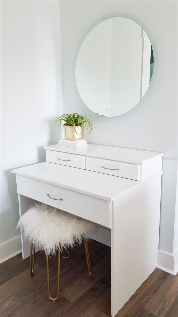 Primary walk-in closet vanity area