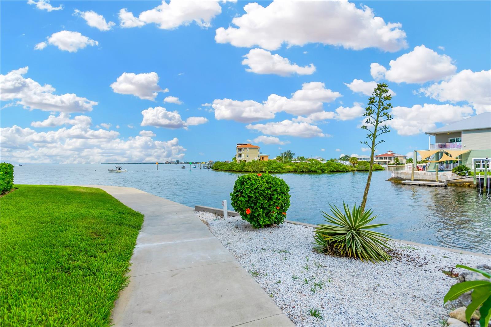 Enjoy a picturesque promenade walkway around the building as you watch the boaters and majestic waterview backdrop.