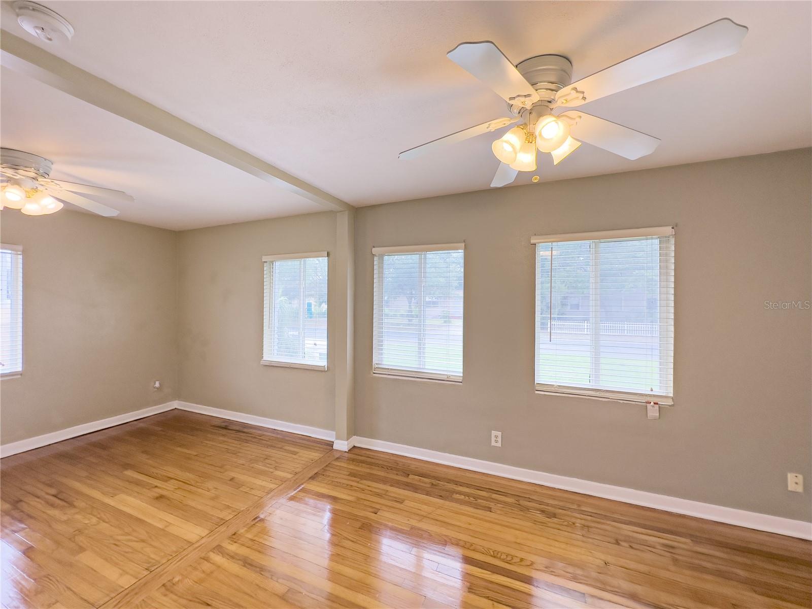 Master bedroom with beautiful polished wood floors