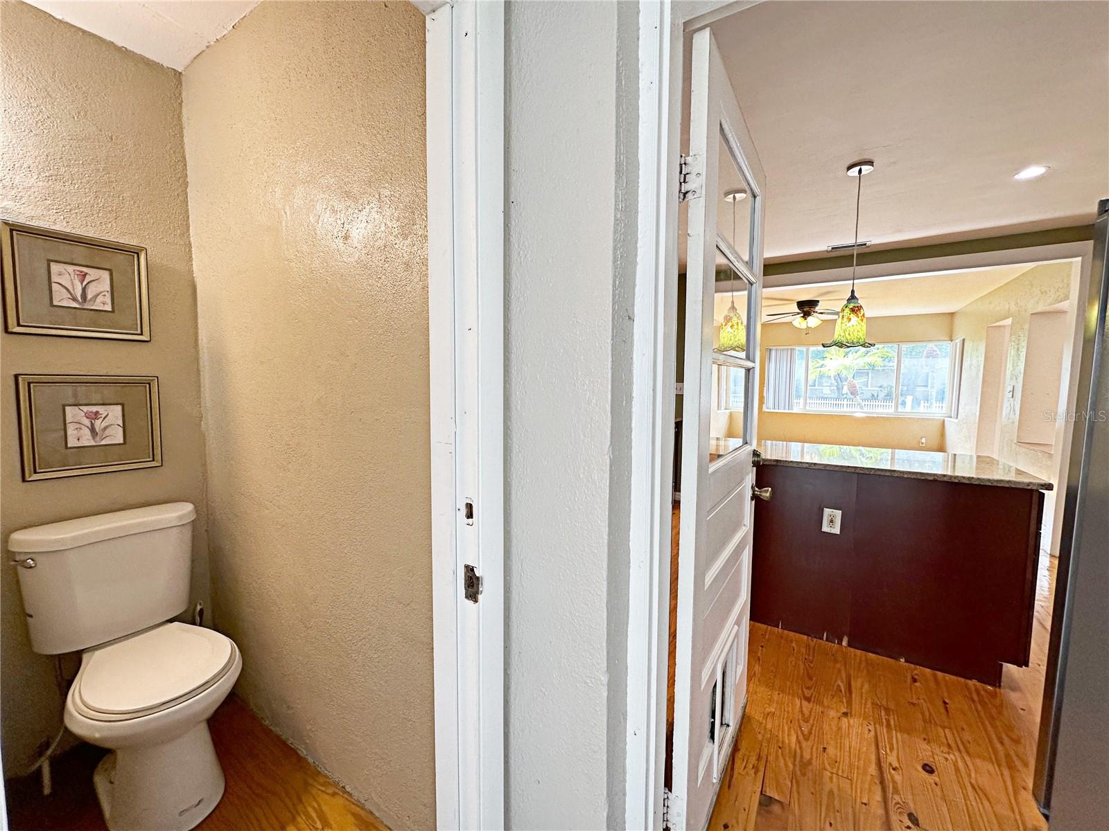 Master bath with view of kitchen