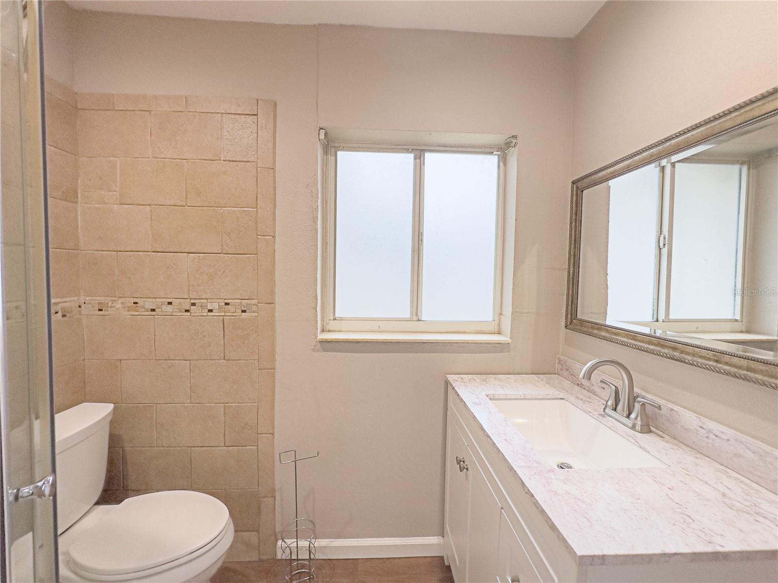 Master bath with new window and vanity