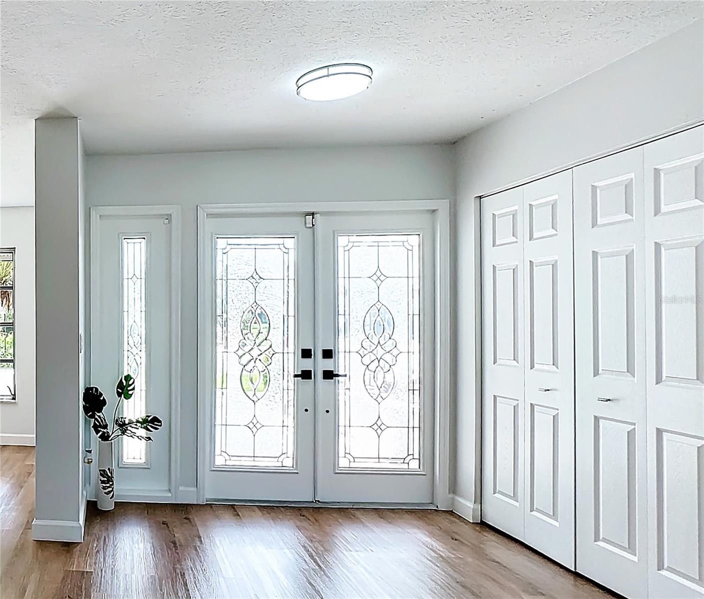 Inside entryway with coat closet