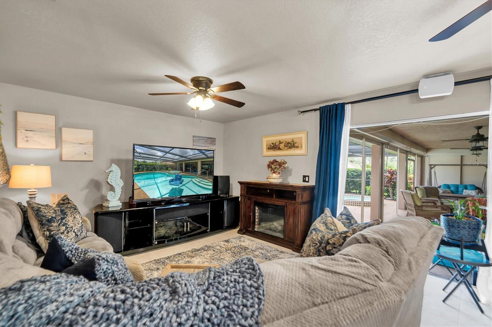 Family room with sliders to lanai & pool