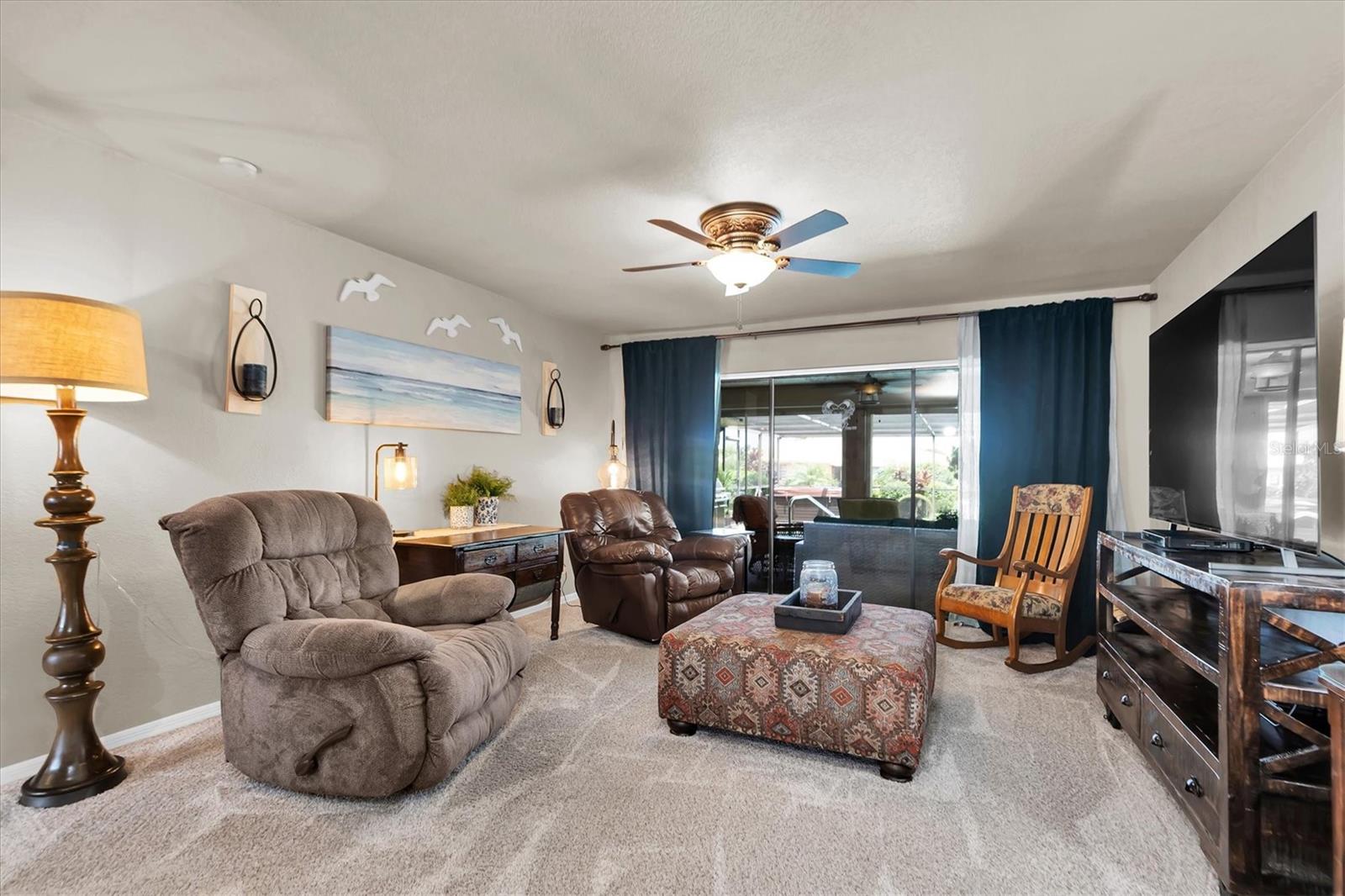 Living room with triple sliding windows