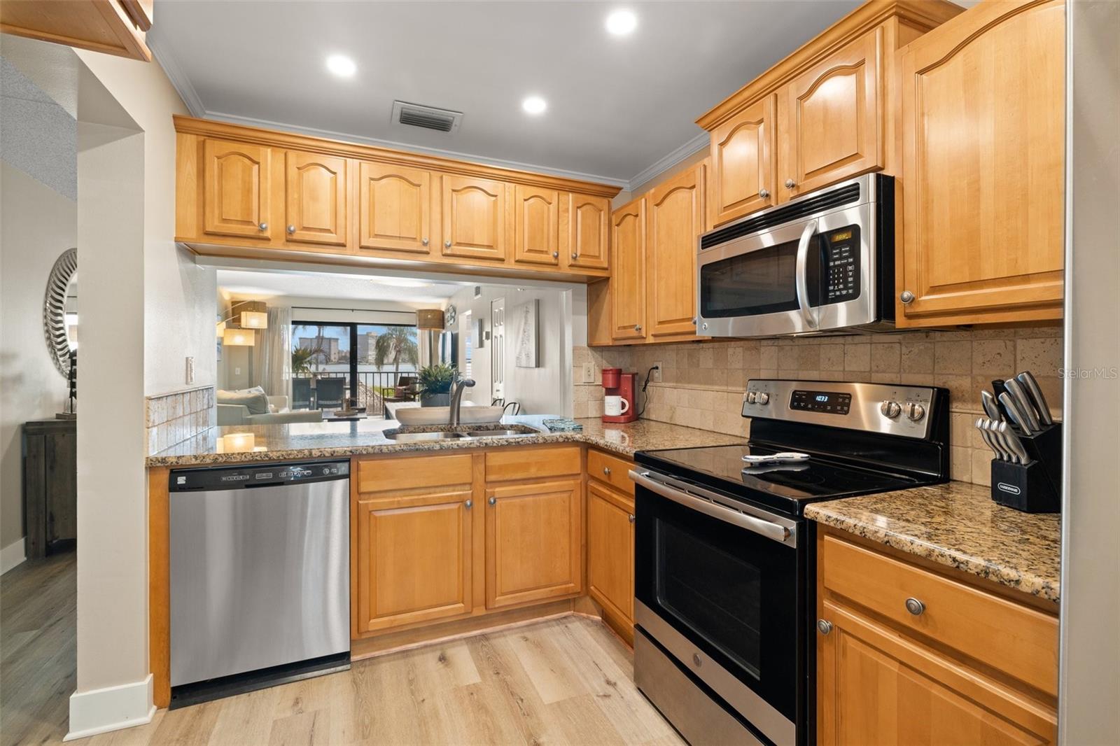 open kitchen with stone countertops