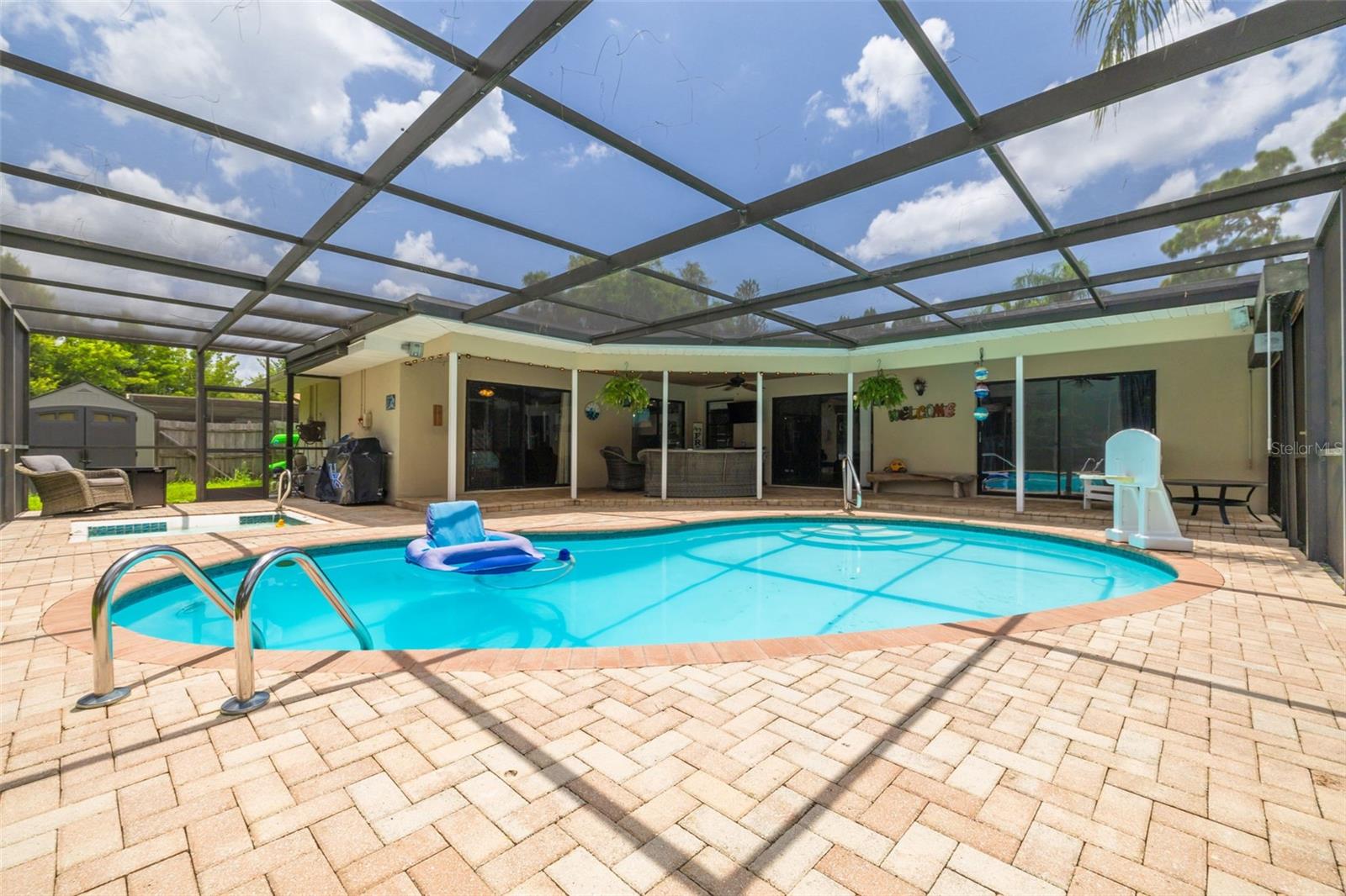 Enjoy the screened-in pool with spa!