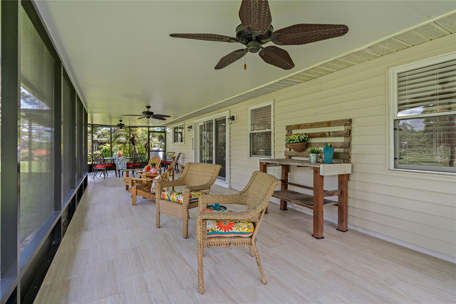 ALL NEW SCREENING AND TRAVERTINE FLOORING IN LANAI!