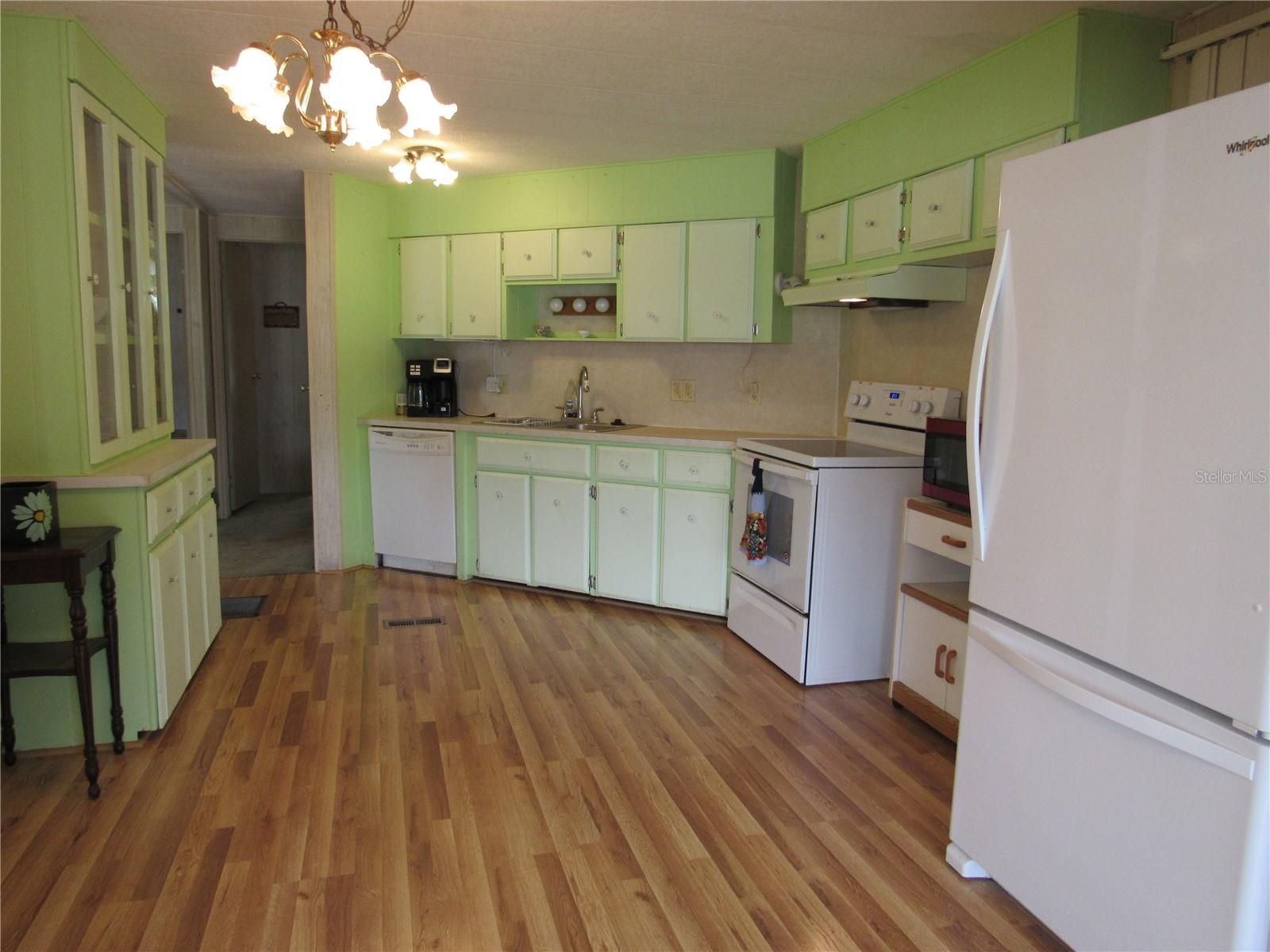 Spacious eat-in kitchen with laminate flooring.