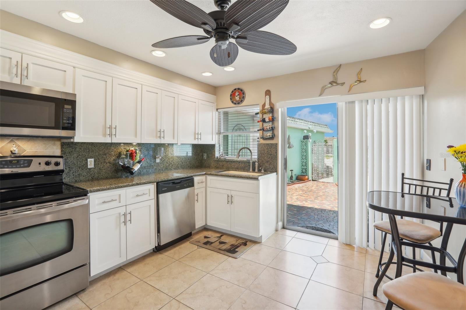 Light and Bright White Kitchen Cabinets with Granite Countertops