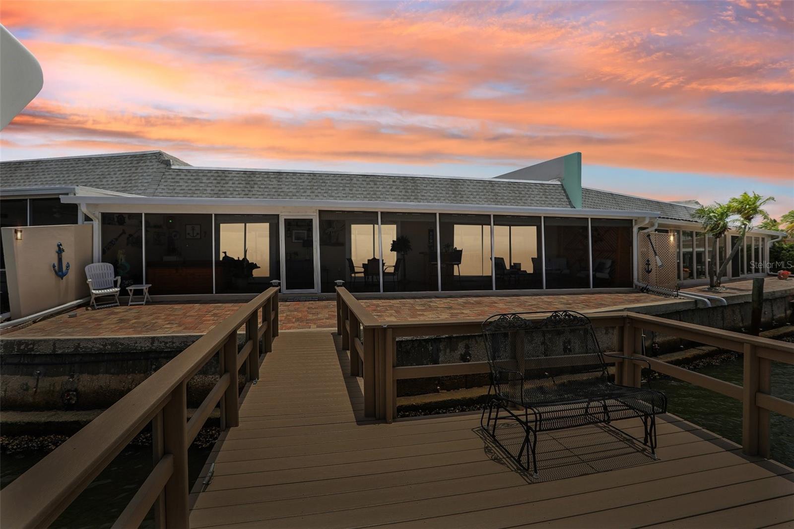 Rear View of Screened Florida Room, Deck and Dock