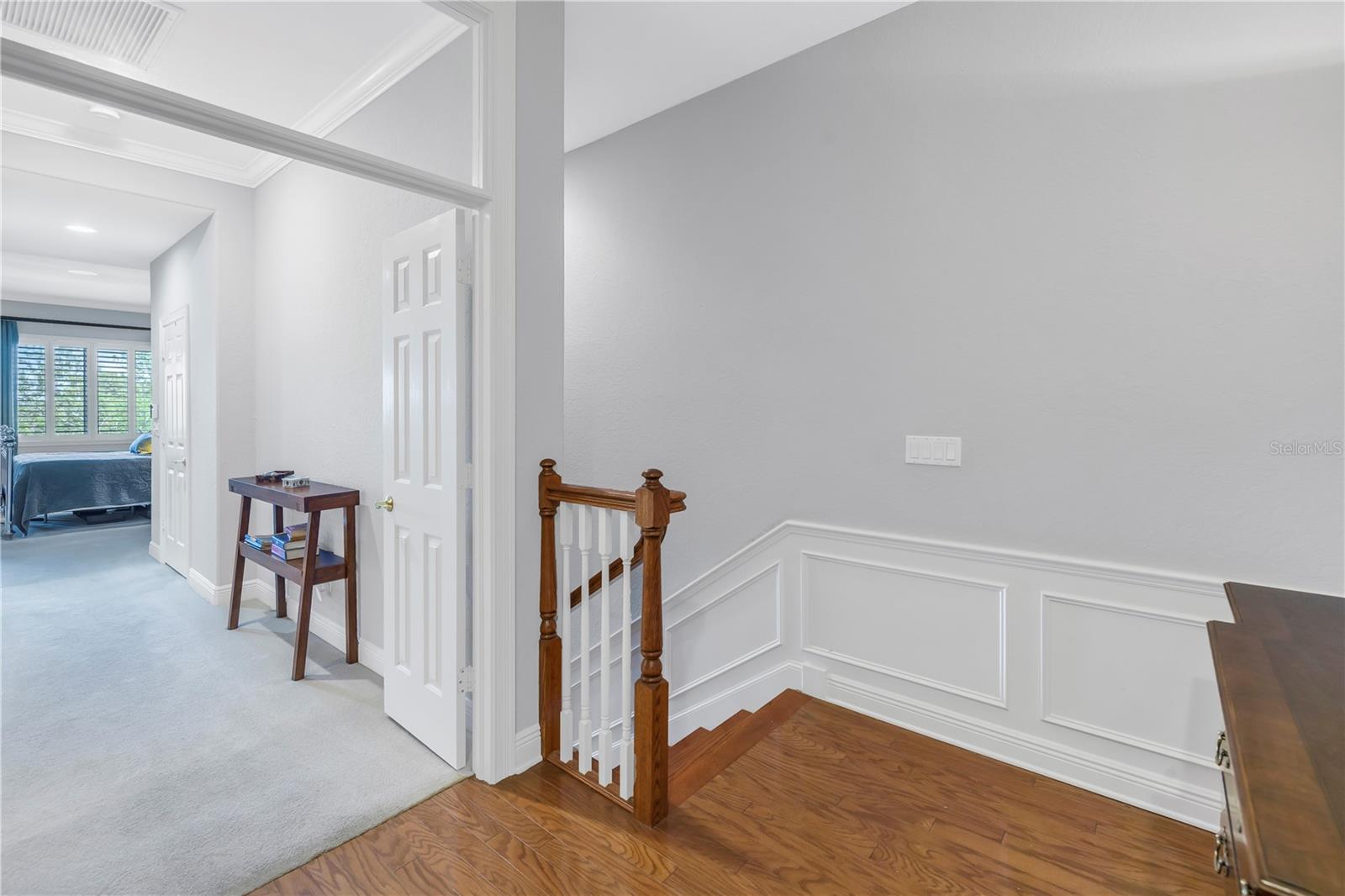 Staircase landing & entry to primary suite