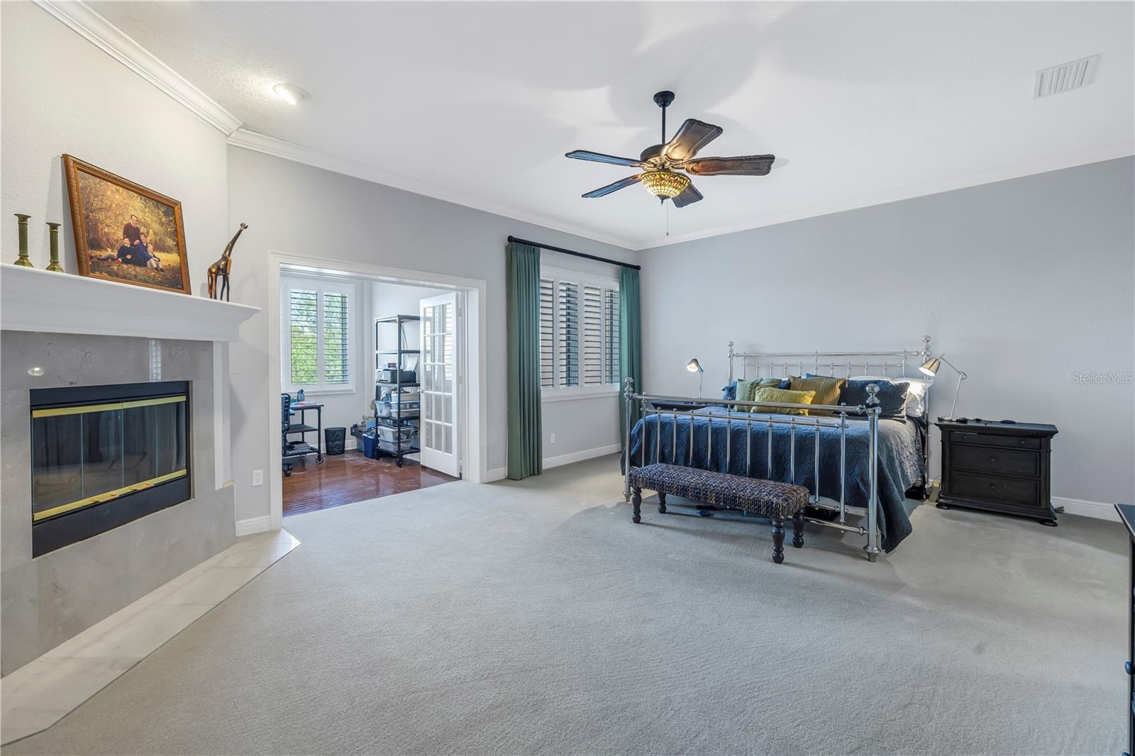 Primary bedroom with wood burning fireplace