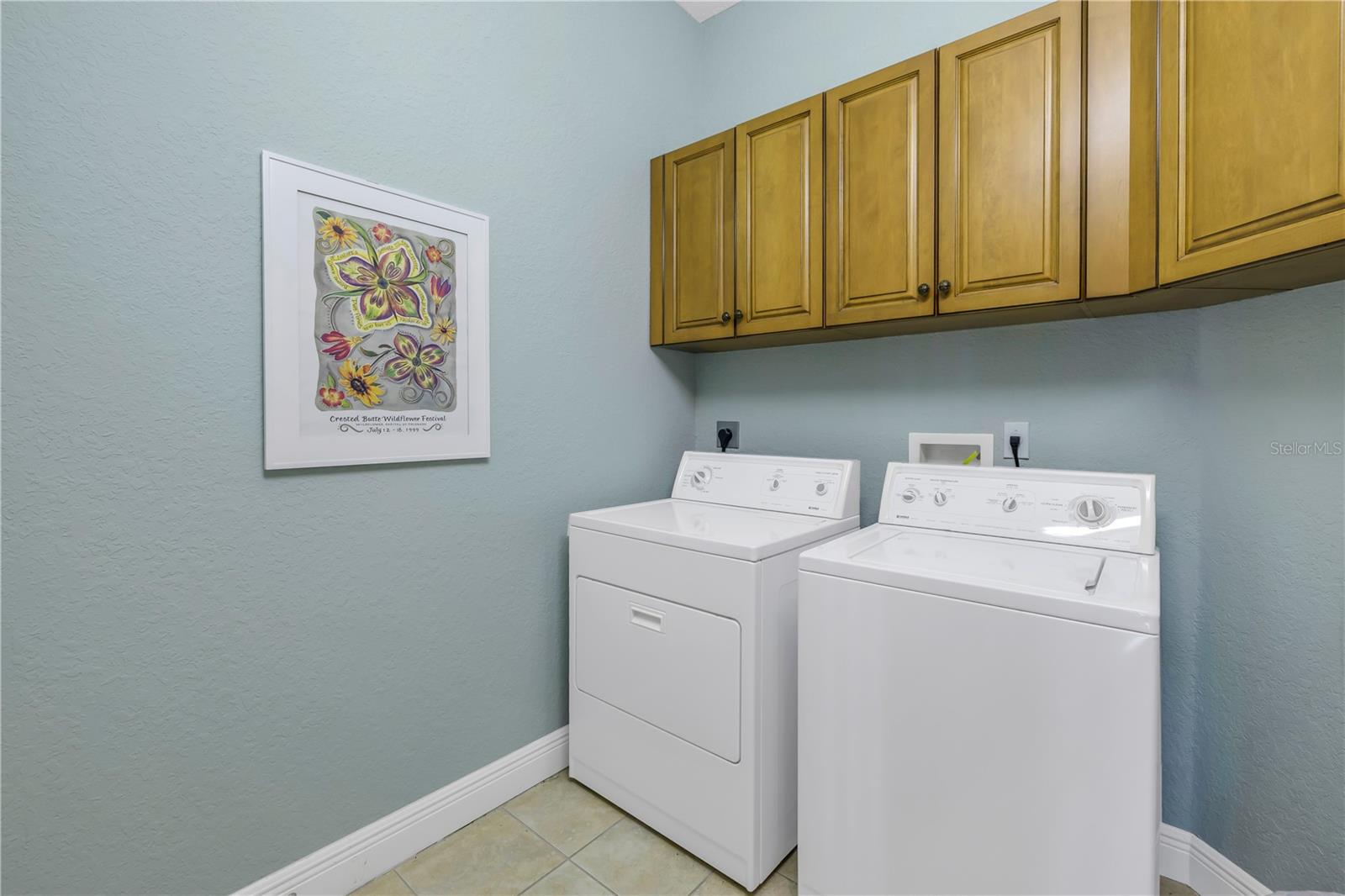 Laundry room with storage & full size washer & dryer