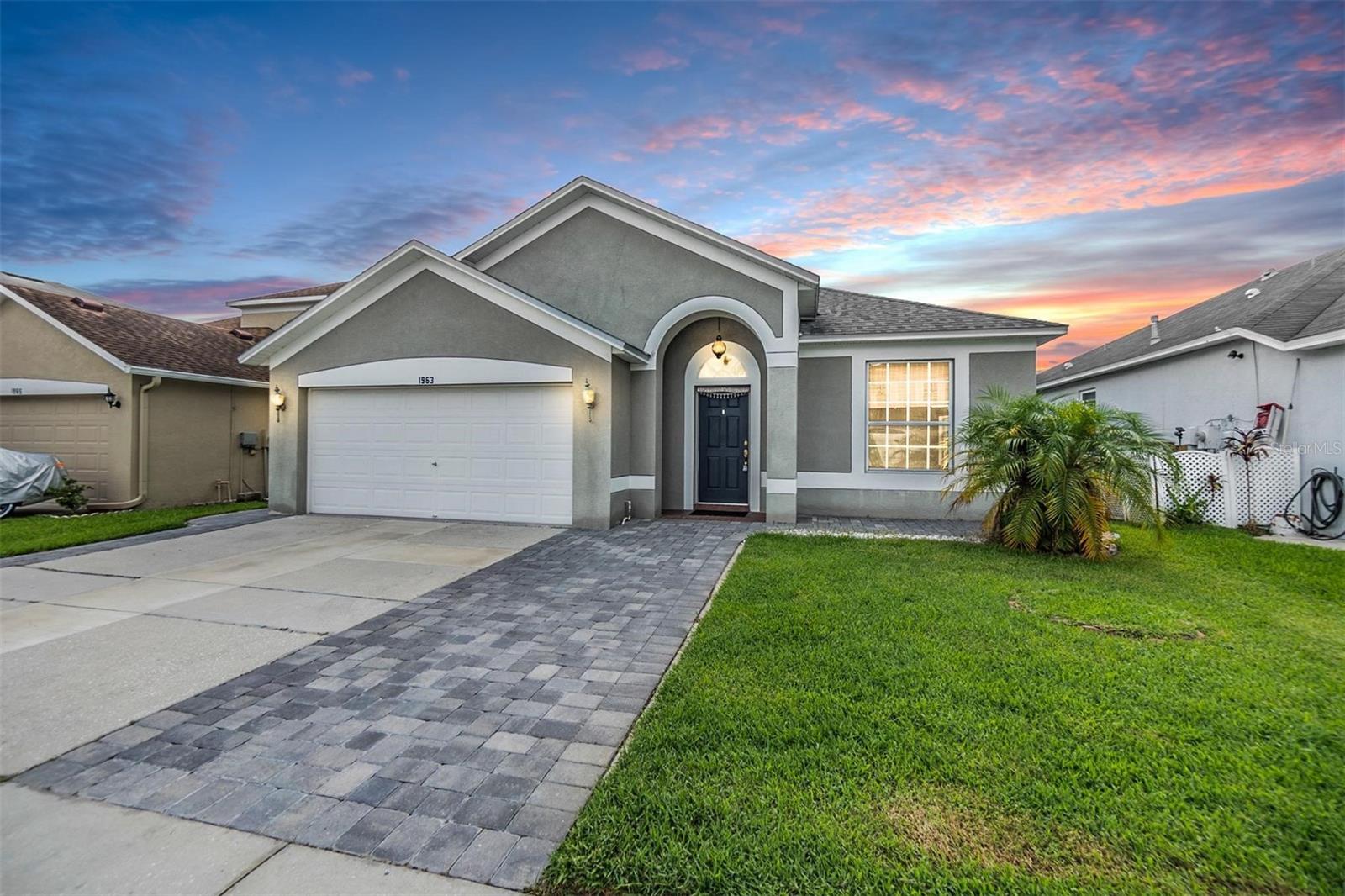 Front Exterior 4 bedrooms/3 bathrooms/Pond View/ 2 Car Garage/Loft area with a bedroom/bathroom upstairs.