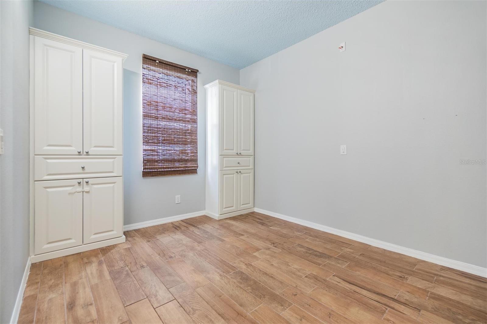 Guest Bedroom, new paint, wood flooring and built in's.