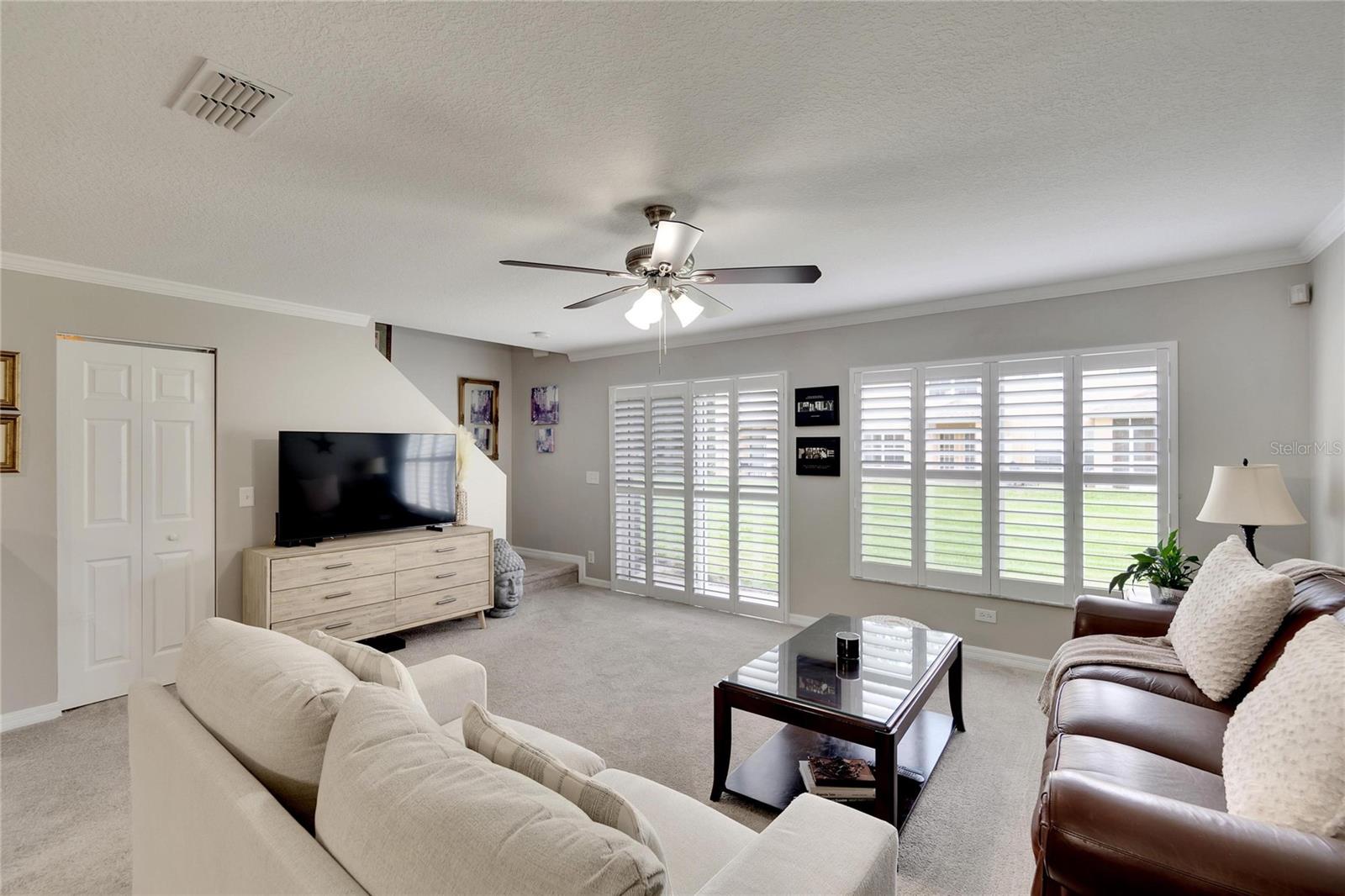 Living Room with back view including California Window Shutters