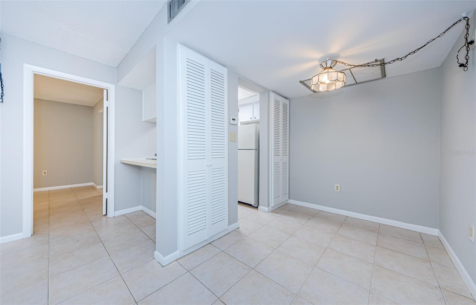 Dining Room w/ built in cabinet shelves.