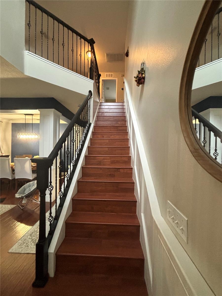 Newly floored stairs and new iron stair rail