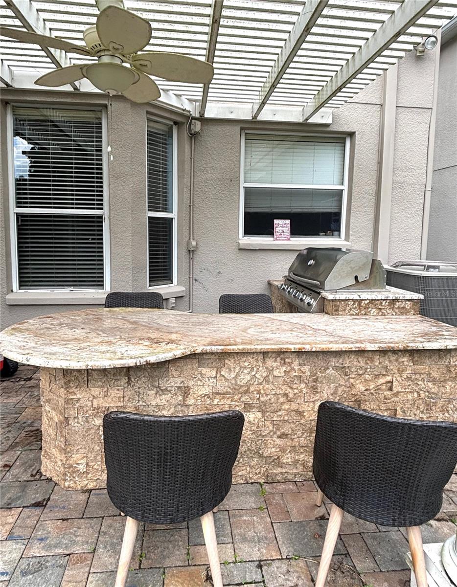 Outdoor grill and granite table with chairs2