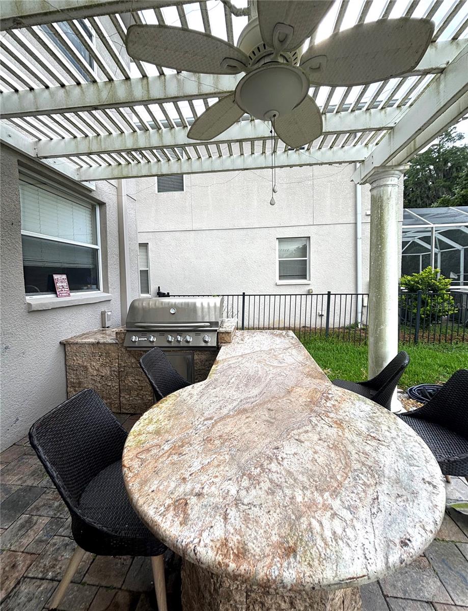 Outdoor grill and granite table with chairs