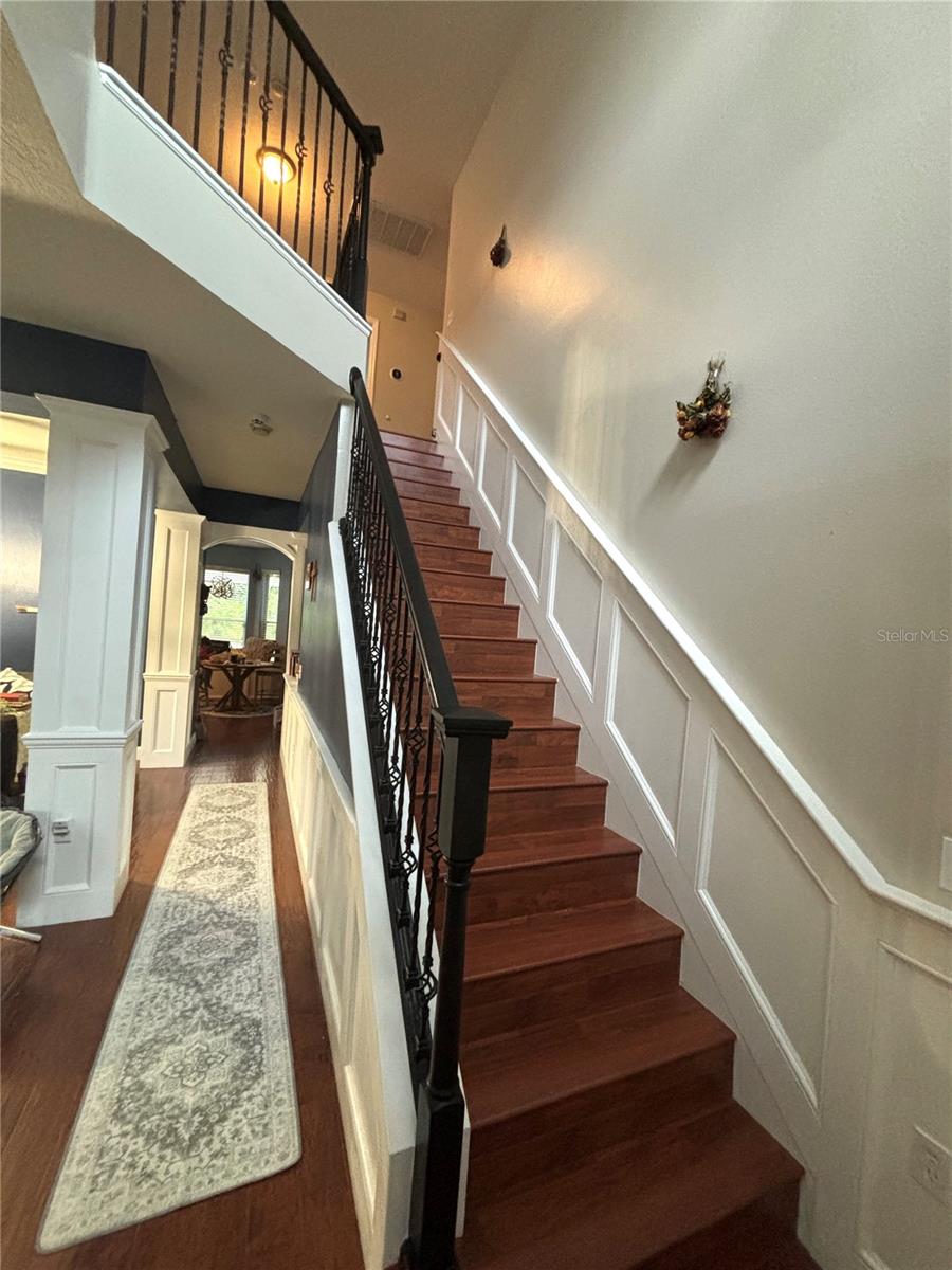 Newly floored stairs and new iron stair rail