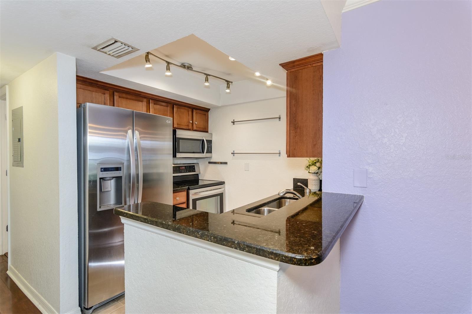 Kitchen with granite counter tops.