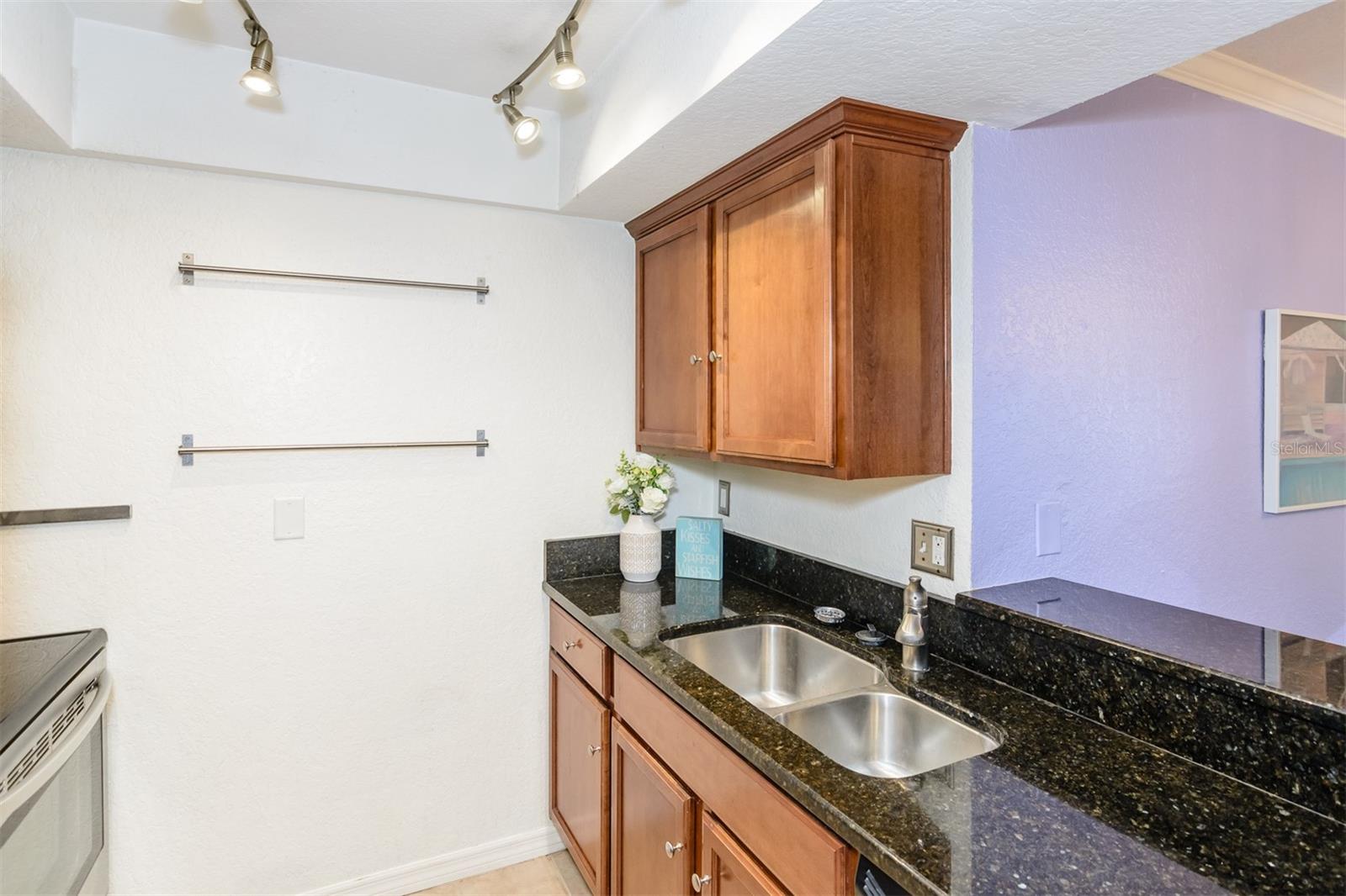 Kitchen with Pots and Pans rack.